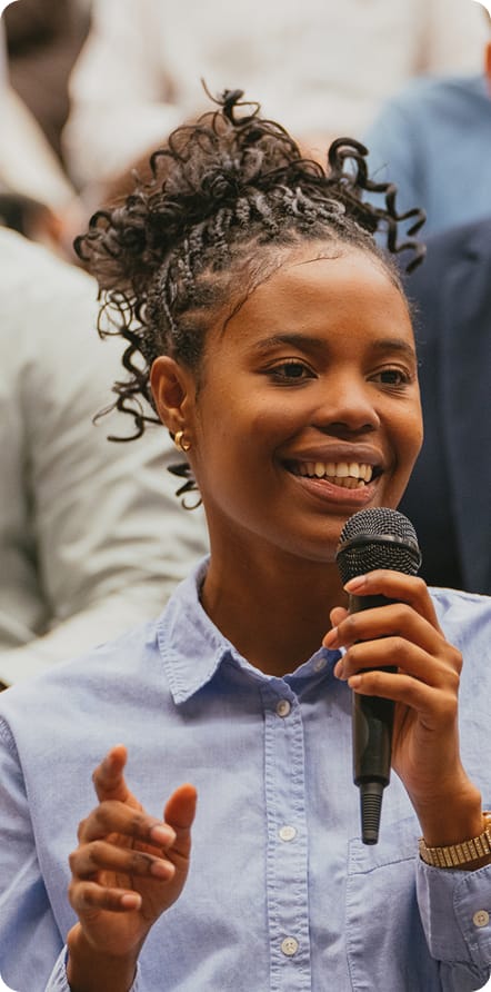 Girl with microphone smiling